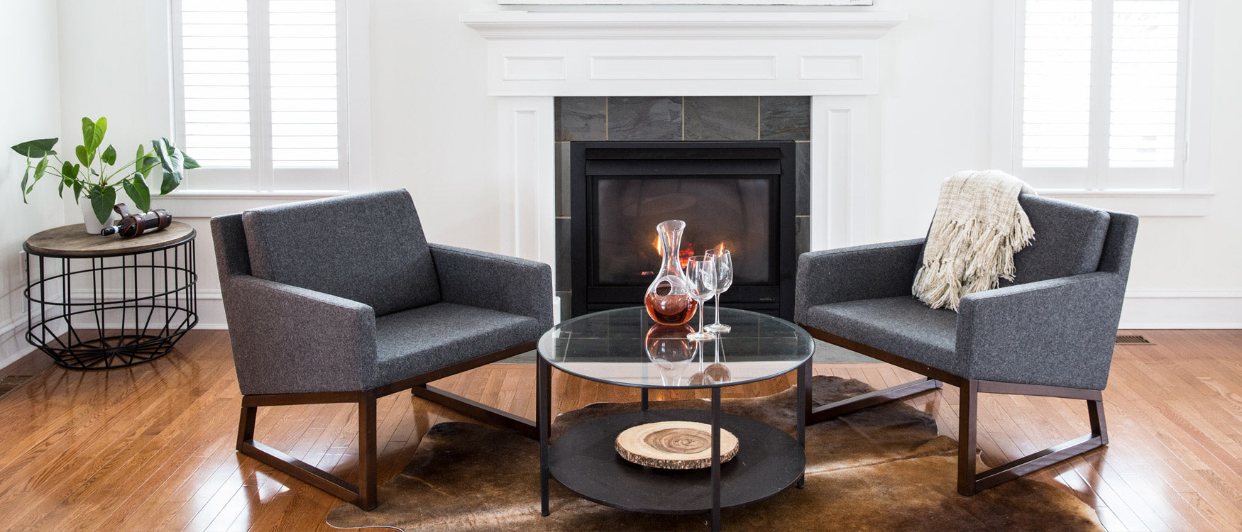 A Modern living room furnished with two sohoConcept chairs and a coffee table