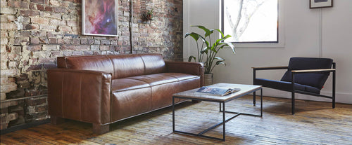 Cabot Sofa by Gus Modern, showing cobat sofa with chair & table in live shot.