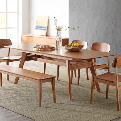 Currant Extendable Dining Table by Greenington, showing live shot of dining table with bench & chairs in live shot.