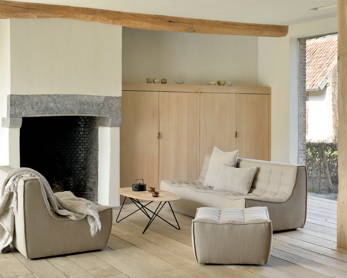 Living room with a three and two seat sofa, along with an ottoman