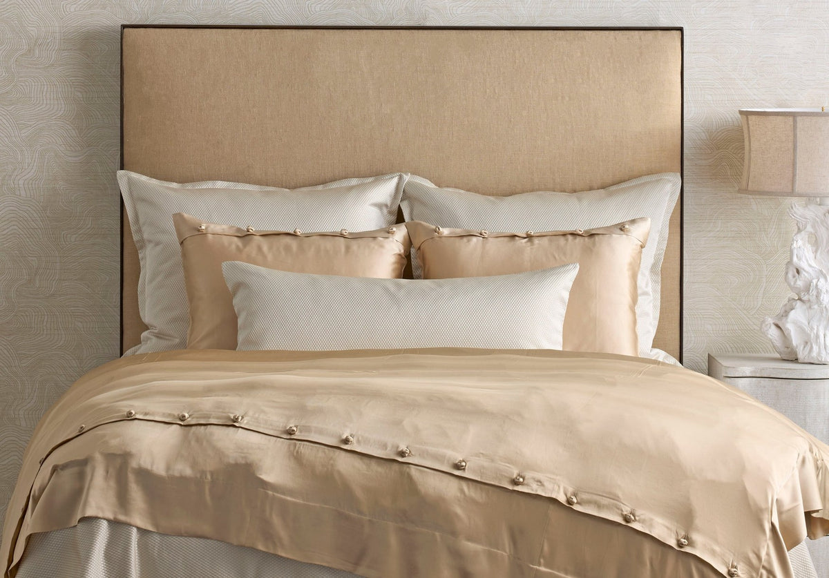 Ann Gish Charmeuse silk duvet cover and shams in Pumice on a linen headboard bed
