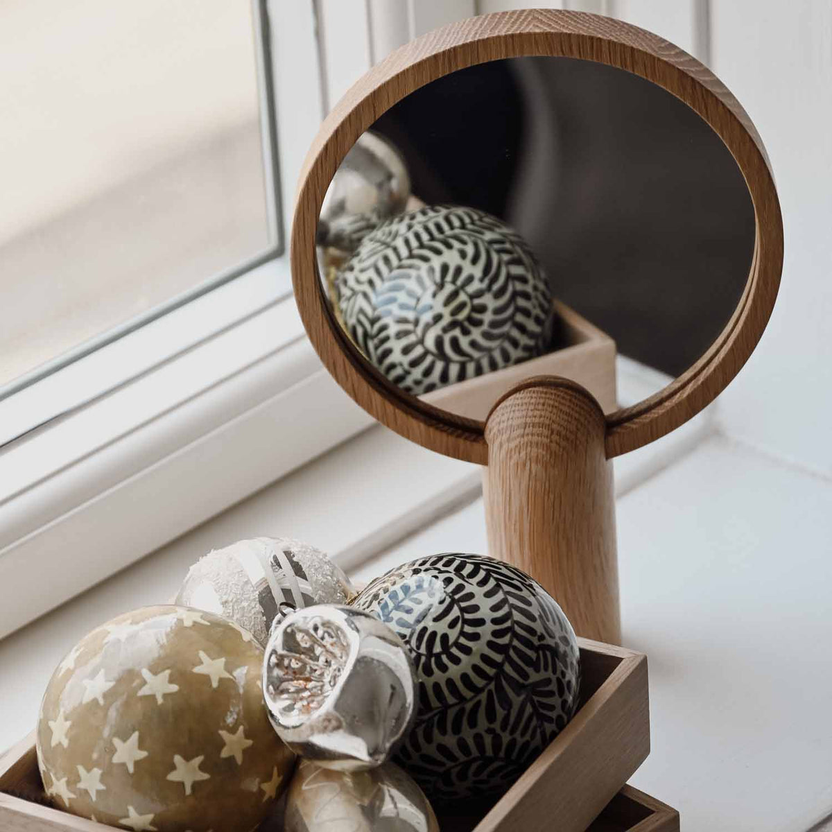 Aino Mirror by Skagerak, showing aino mirror in live shot.
