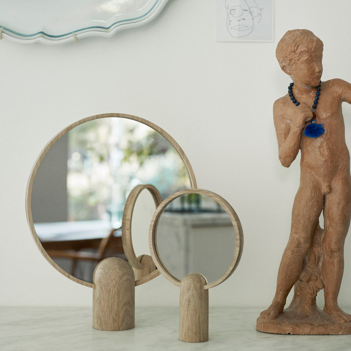 Aino Mirror by Skagerak, showing aino mirror in live shot.