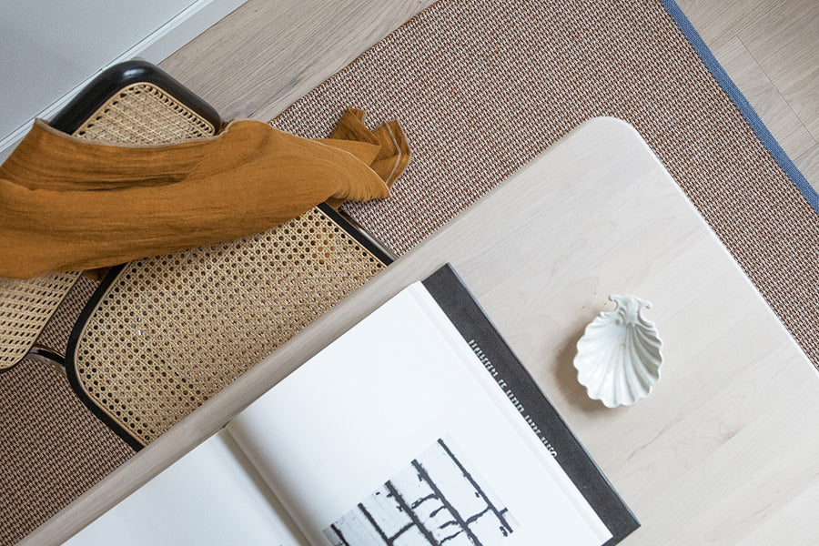 Benny Woven Plastic Rug by Brita, showing benny woven plastic rug in live shot.