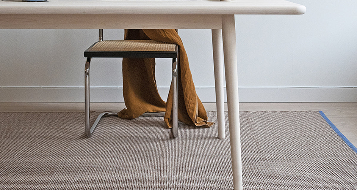 Benny Woven Plastic Rug by Brita, showing benny woven plastic rug in live shot.