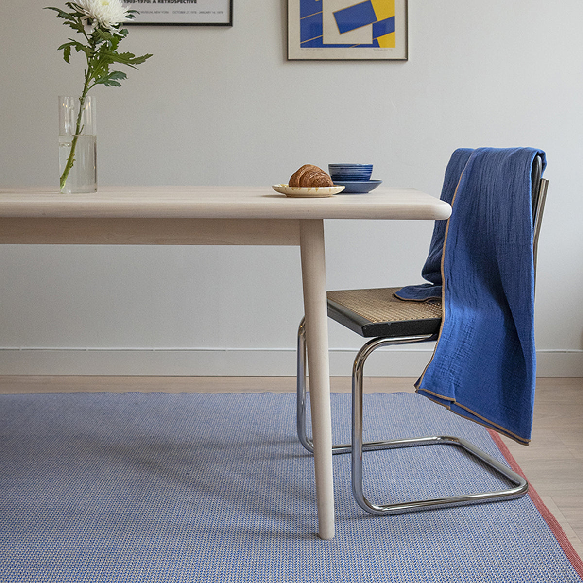 Benny Woven Plastic Rug by Brita, showing benny woven plastic rug in live shot.