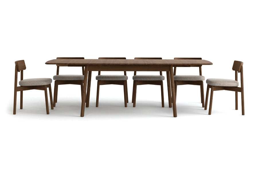 Baton Four Leg Extension Table by Copeland Furniture, showing front view of baton four leg extension table with chair.