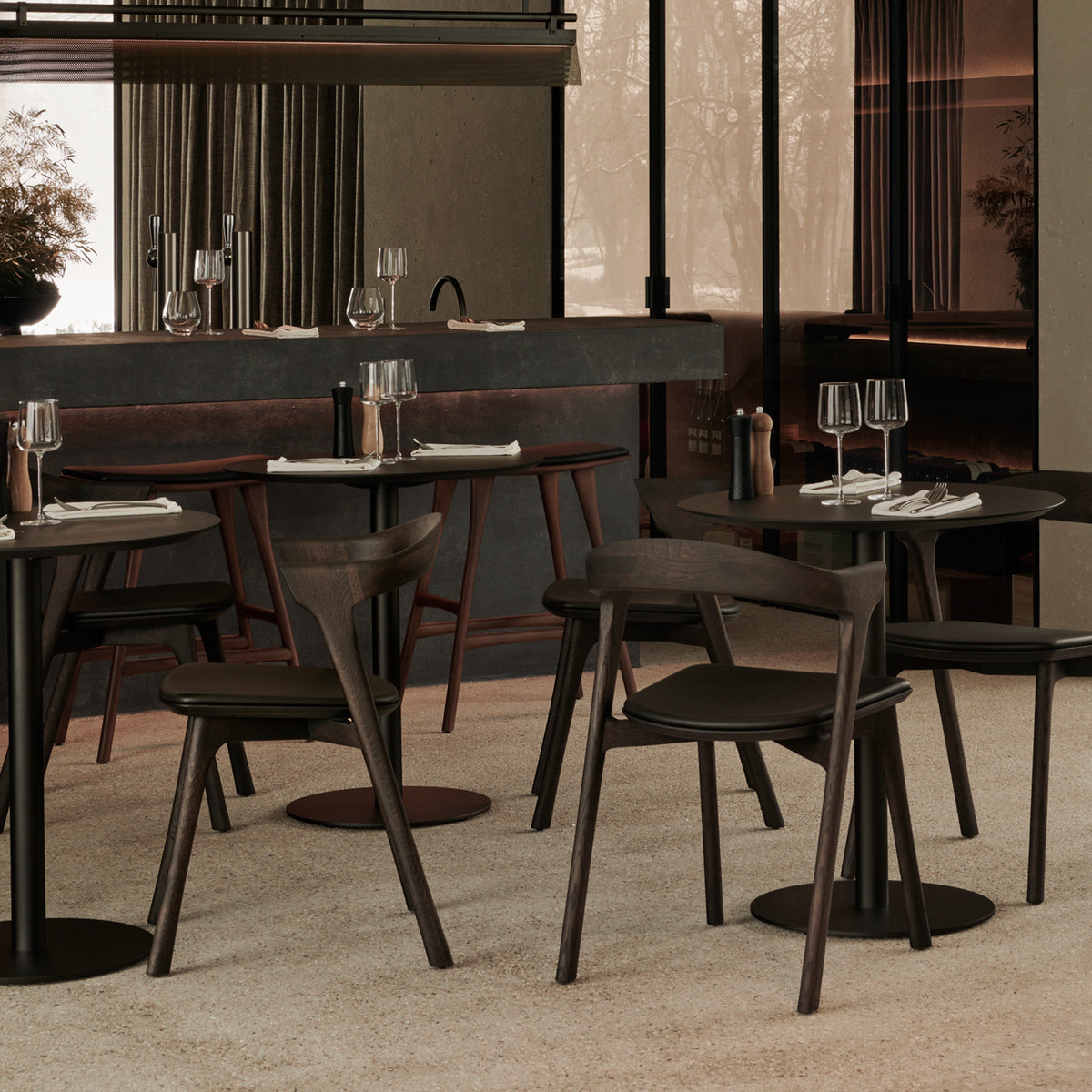 Blend Dining Table by Ethnicraft, showing blend dining tables in live shot.