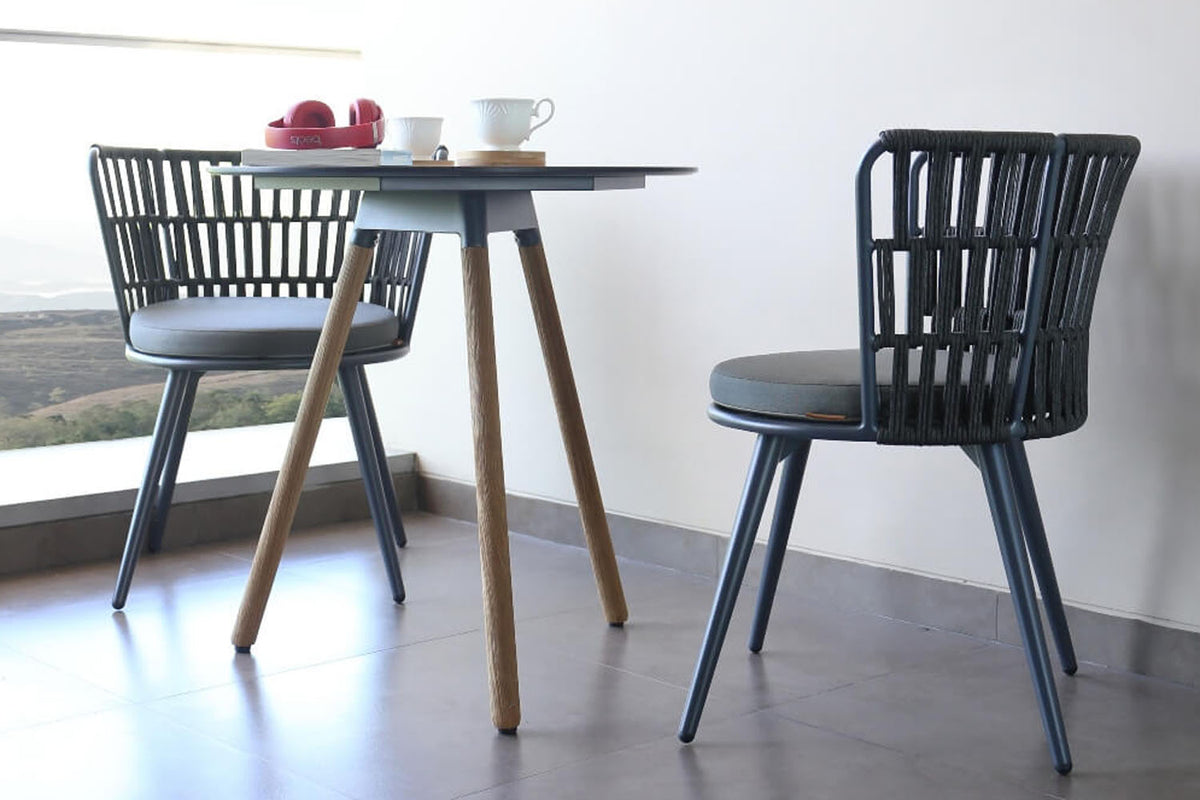 Daisy Balcony Table Teak Legs by Mamagreen, showing daisy balcony table teak legs in live shot.