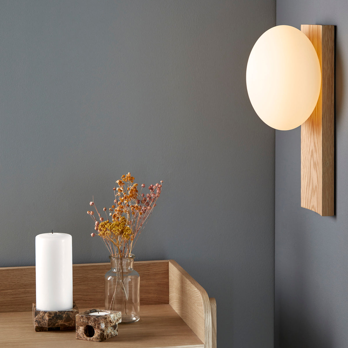 Dew Table/Wall Lamp by Woud, showing dew table/wall lamp in live shot.