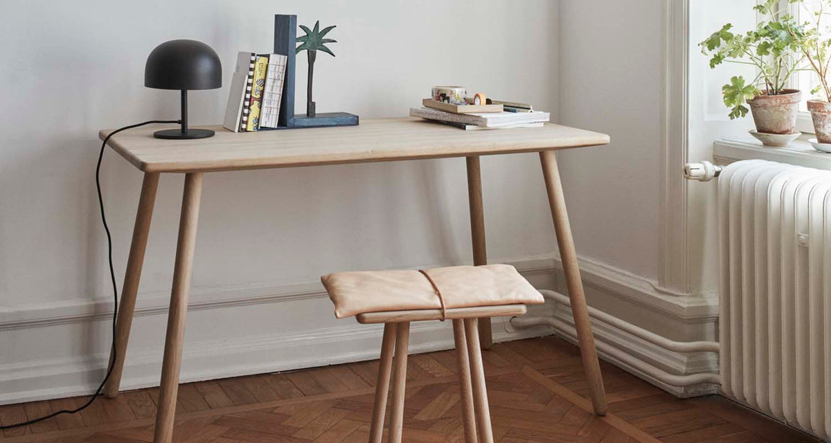 Georg Desk by Fritz Hansen, showing georg desk in live shot.