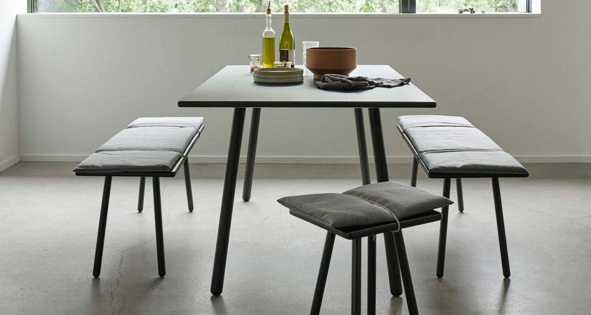 Georg Dining Table by Fritz Hansen, showing georg dining table in live shot.