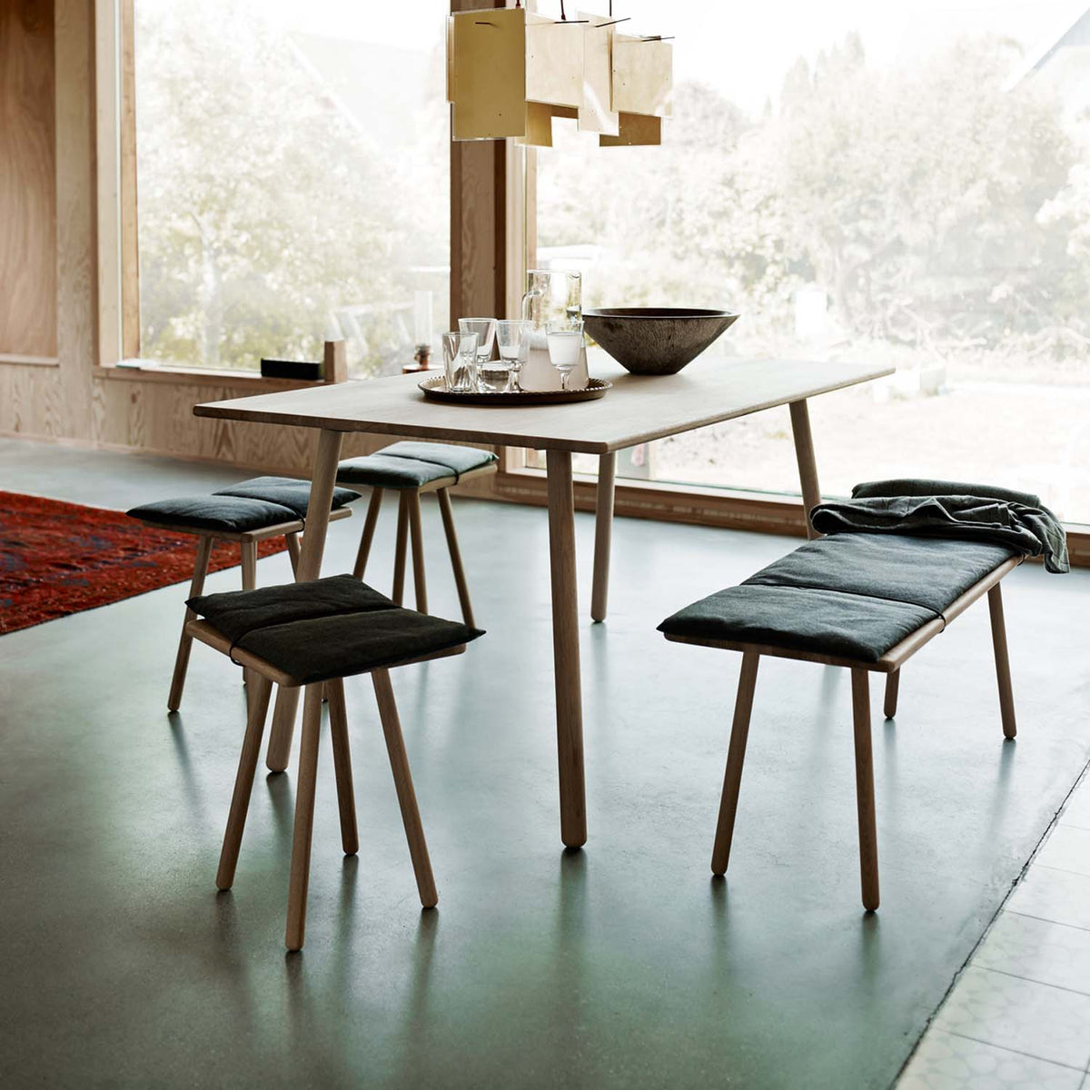 Georg Dining Table by Fritz Hansen, showing georg dining table in live shot.