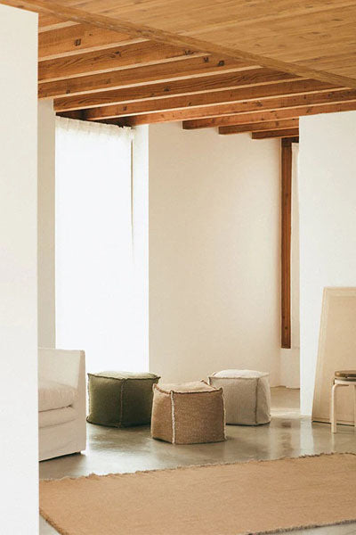 Handloom Pouf by Lorena Canals, showing handloom pouf in live shot.