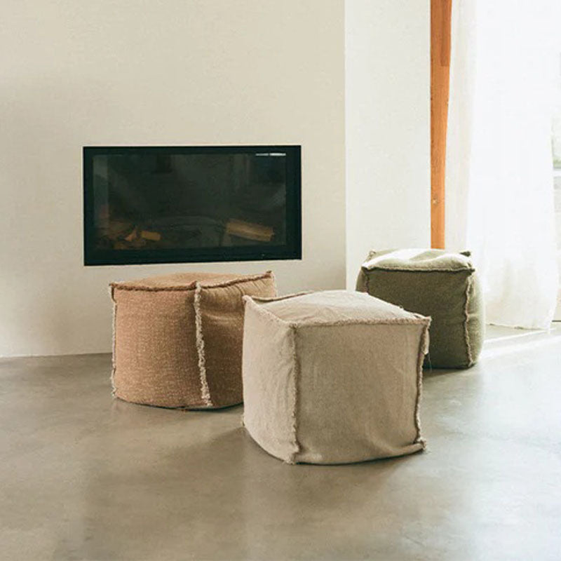 Handloom Pouf by Lorena Canals, showing handloom pouf in live shot.