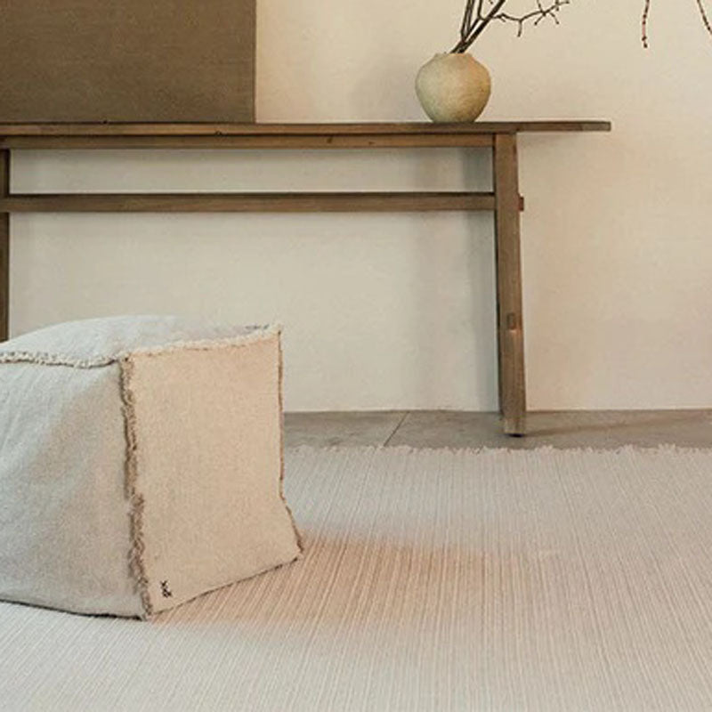 Handloom Pouf by Lorena Canals, showing handloom pouf in live shot.