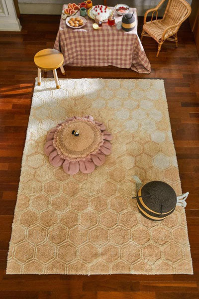 Planet Bee Washable Rug by Lorena Canals, showing planet bee washable rug in live shot.