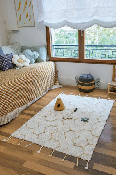 Planet Bee Washable Rug by Lorena Canals, showing planet bee washable rug in live shot.