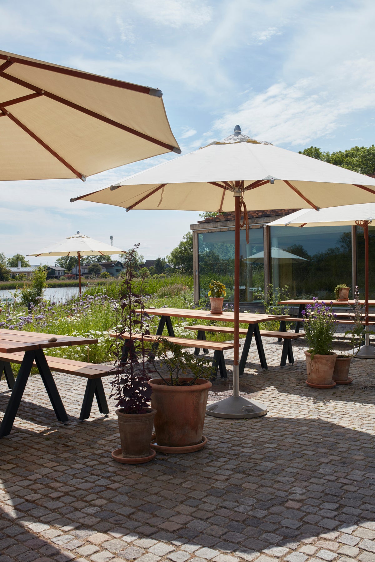 Atlantis Outdoor Umbrella by Skagerak, showing atlantis outdoor umbrella in live shot.