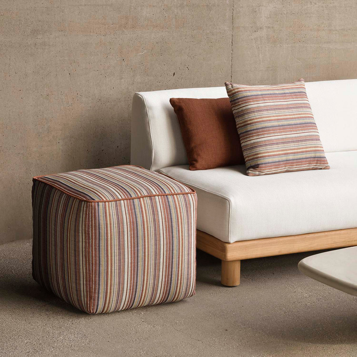 Zahara Outdoor Pouf by Ethnicraft, showing zahara outdoor pouf in the live shot.