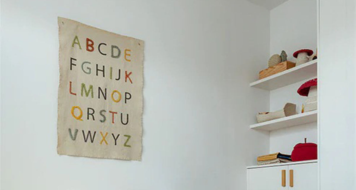 ABC Wall Hanger by Lorena Canals, showing abc wall hanger in live shot.