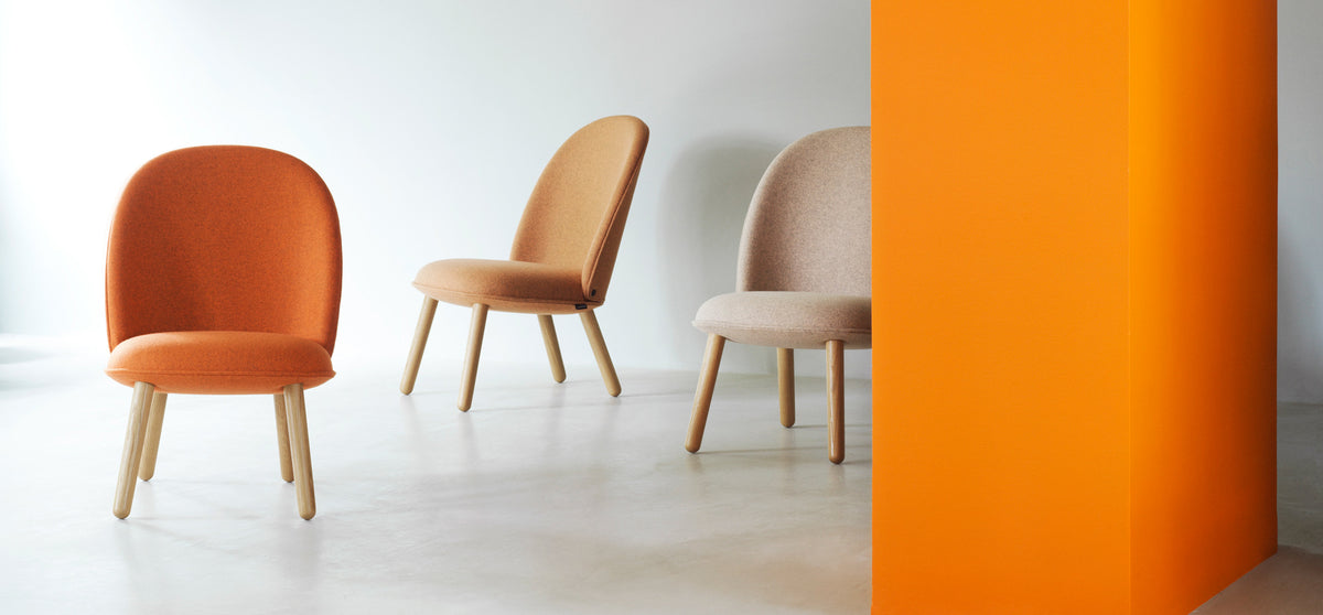 Ace Lounge Upholstery Chair by Normann Copenhagen, showing ace lounge upholstery chairs in live shot.