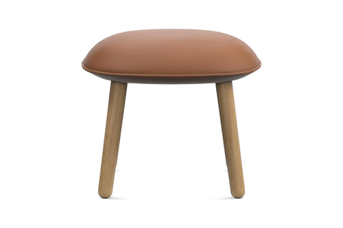 Ace Upholstery Footstool by Normann Copenhagen, showing front view of ace upholstery footstool in lacquered oak wood/ultra leathers.