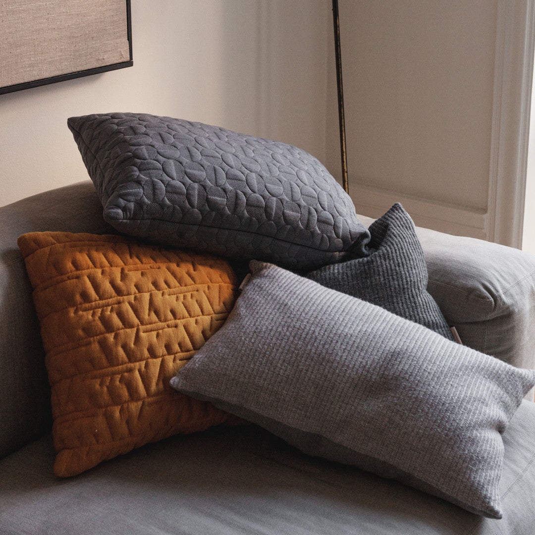 Aiayu Cushion by Fritz Hansen, showing aiayu cushions in live shot.