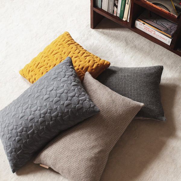 Aiayu Cushion by Fritz Hansen, showing aiayu cushions in live shot.