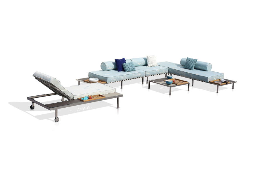 Albatross 316 Configurations 3 by Mamagreen, showing angle view of albatross 316 configurations 3 in heron white keops webbing/mixed/performance textiles (grade a)/mixed tray top with coffee table & sunlounger.