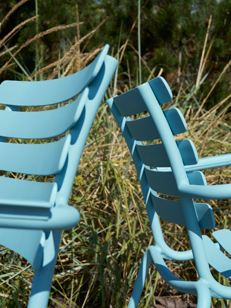 Alua Lounge Chair by Houe, showing closeup view of alua lounge chairs in live shot.