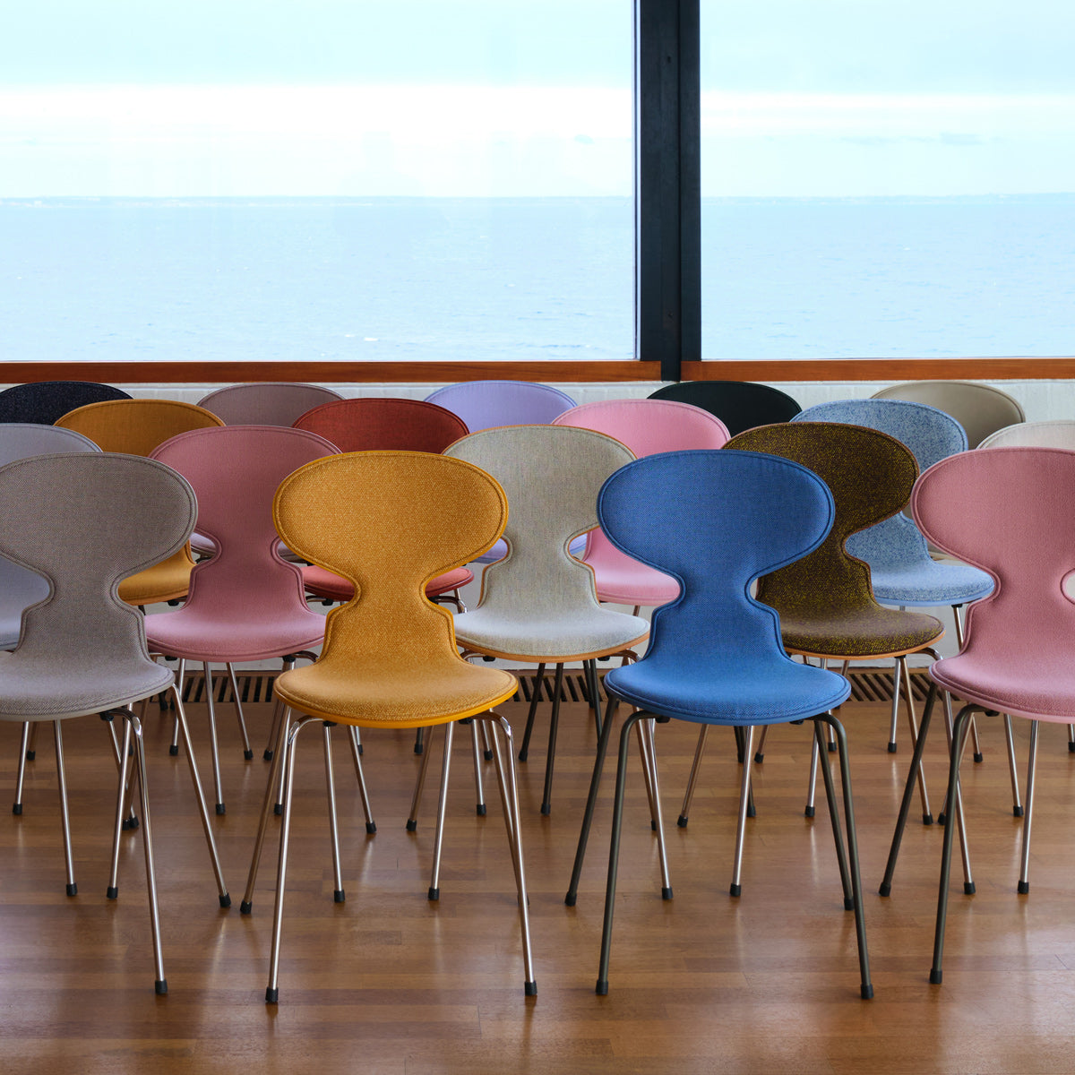 Ant Front Upholstery Chair by Fritz Hansen, showing ant front upholstery chairs in live shot.