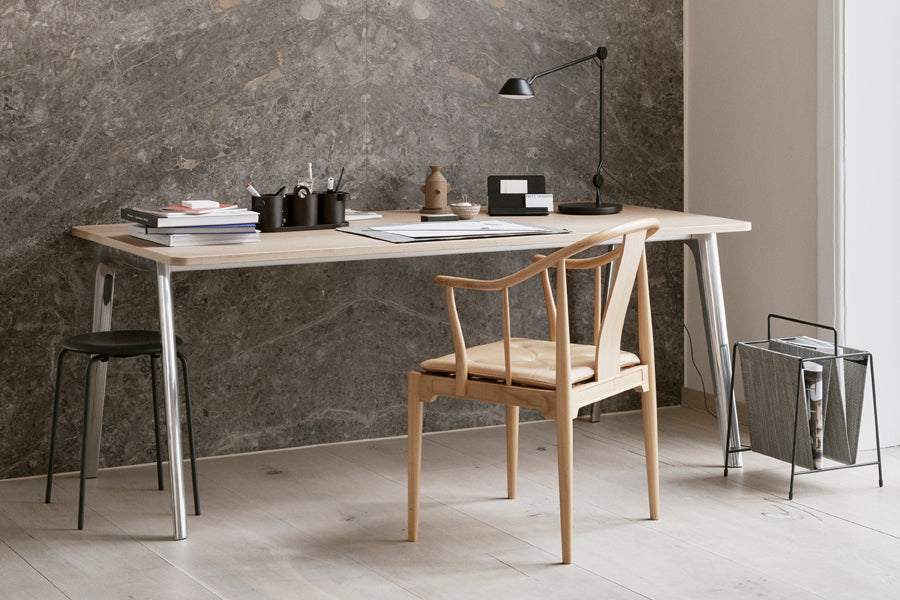 AQ01 Table Lamp by Fritz Hansen, showing aq01 table lamp in live shot.