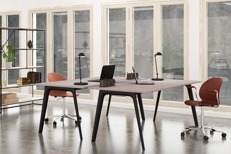 AQ01 Table Lamp by Fritz Hansen, showing aq01 table lamps in live shot.