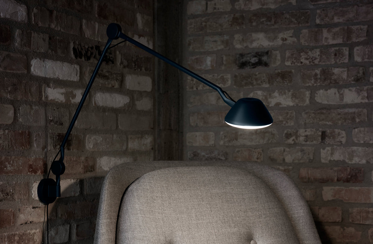 AQ01 Wall Lamp by Fritz Hansen, showing aq01 wall lamp in live shot.