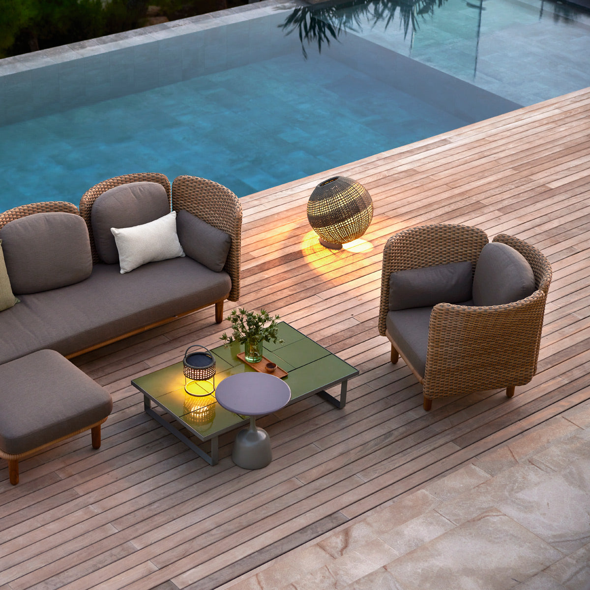 Arch Lounge Chair by Cane-Line, showing arch lounge chair in live shot.