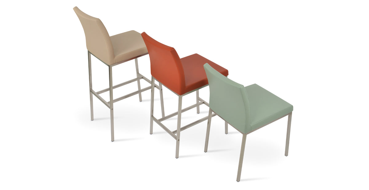 Aria Metal Counter Stool by SohoConcept, showing counter & bar stools in together with chair.