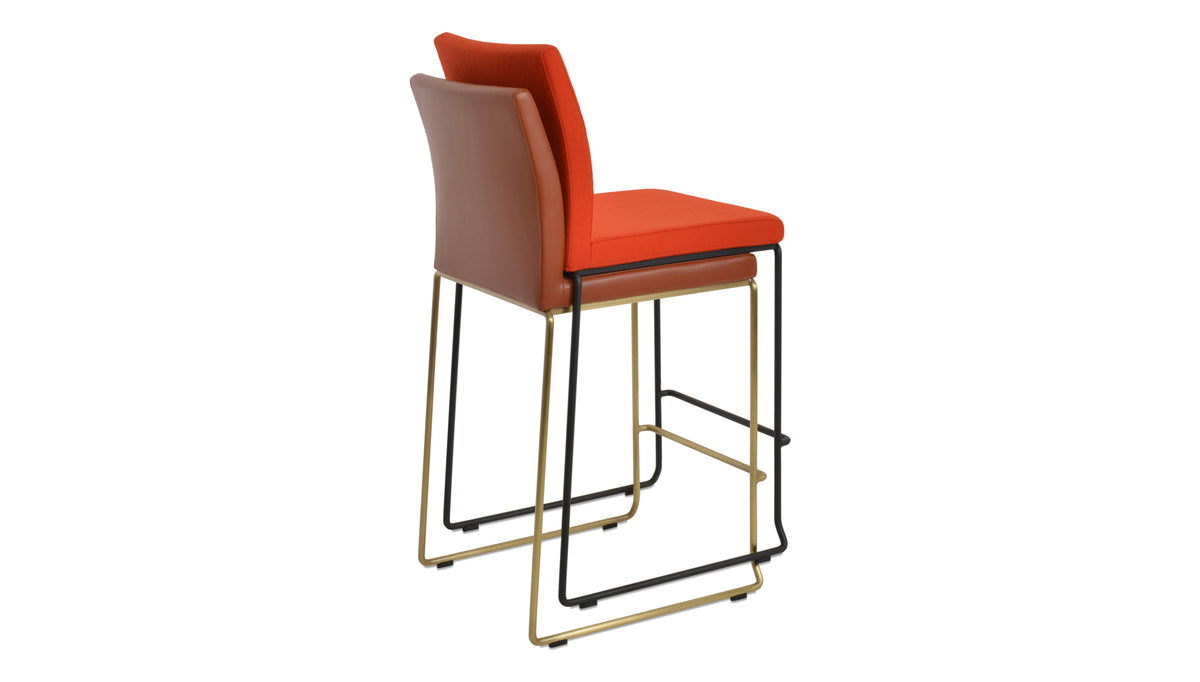 Aria Wire Stackable Counter Stool by SohoConcept, showing back view of aria wire stackable counter stools in brass wire/cinnamon ppm-fr & black powder wire/camira blazer orange wool.