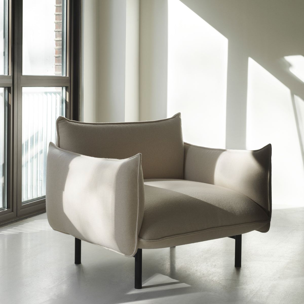 Ark Armchair by Normann Copenhagen, showing ark armchair in live shot.