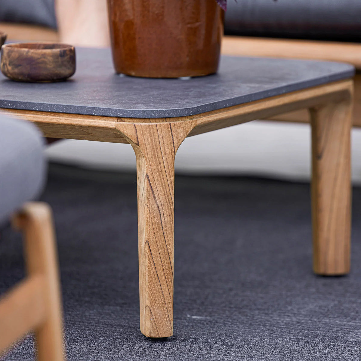 Aspect Coffee Table by Cane-Line, showing closeup view of aspect coffee table in live shot.