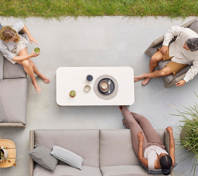 Aspect Coffee Table by Cane-Line, showing aspect coffee table in live shot.