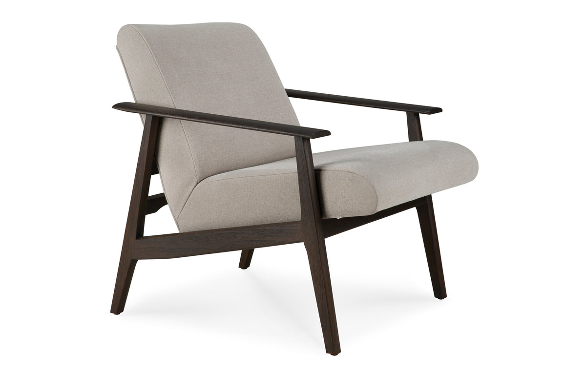 Aspekt Lounge Chair by Ethnicraft, showing angle view of aspekt lounge chair.