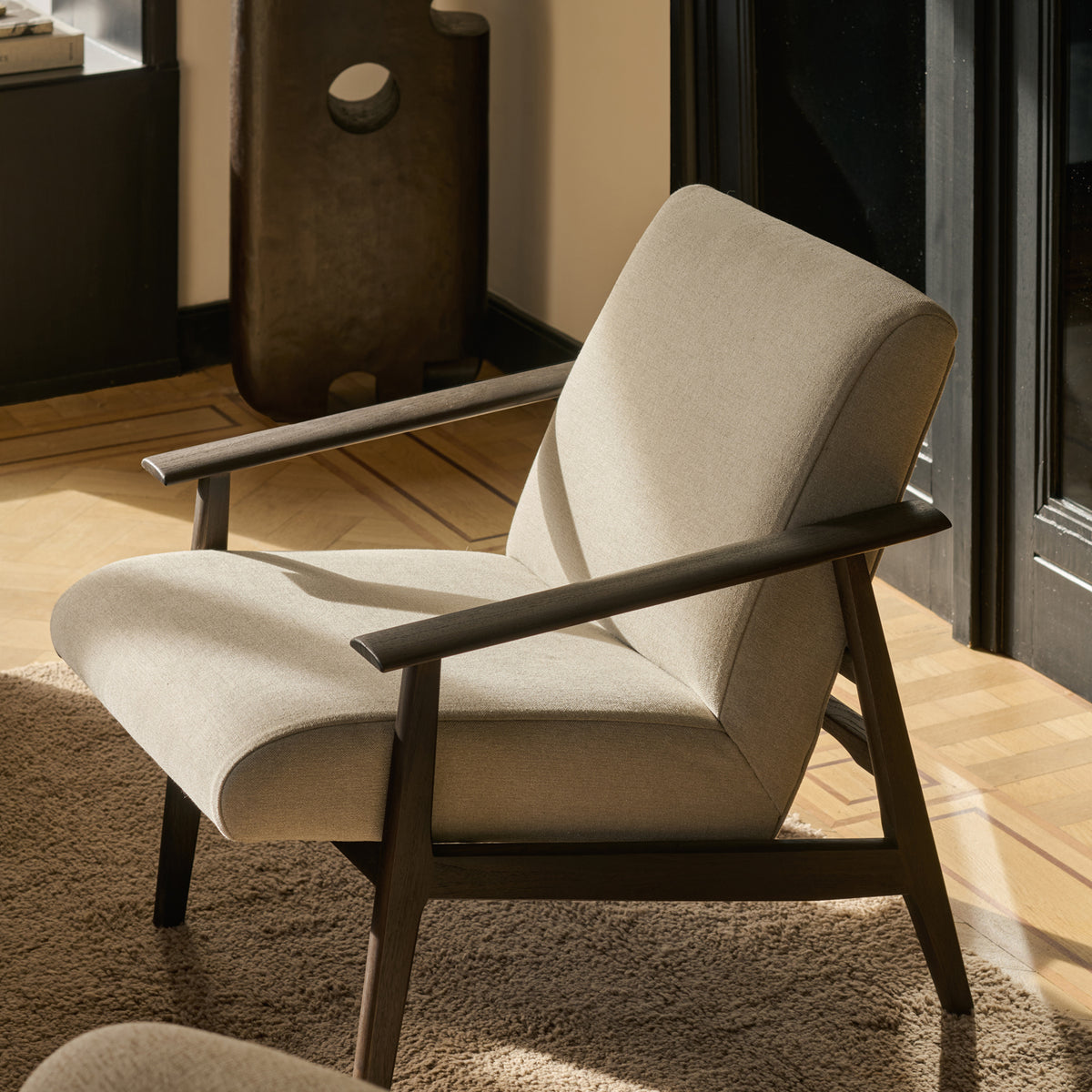 Aspekt Lounge Chair by Ethnicraft, showing aspekt lounge chair in live shot.