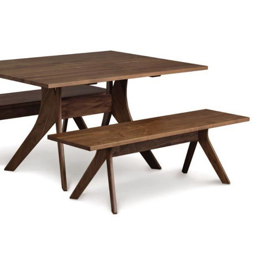 Audrey Bench by Copeland Furniture, showing natural walnut audrey bench with dining table.