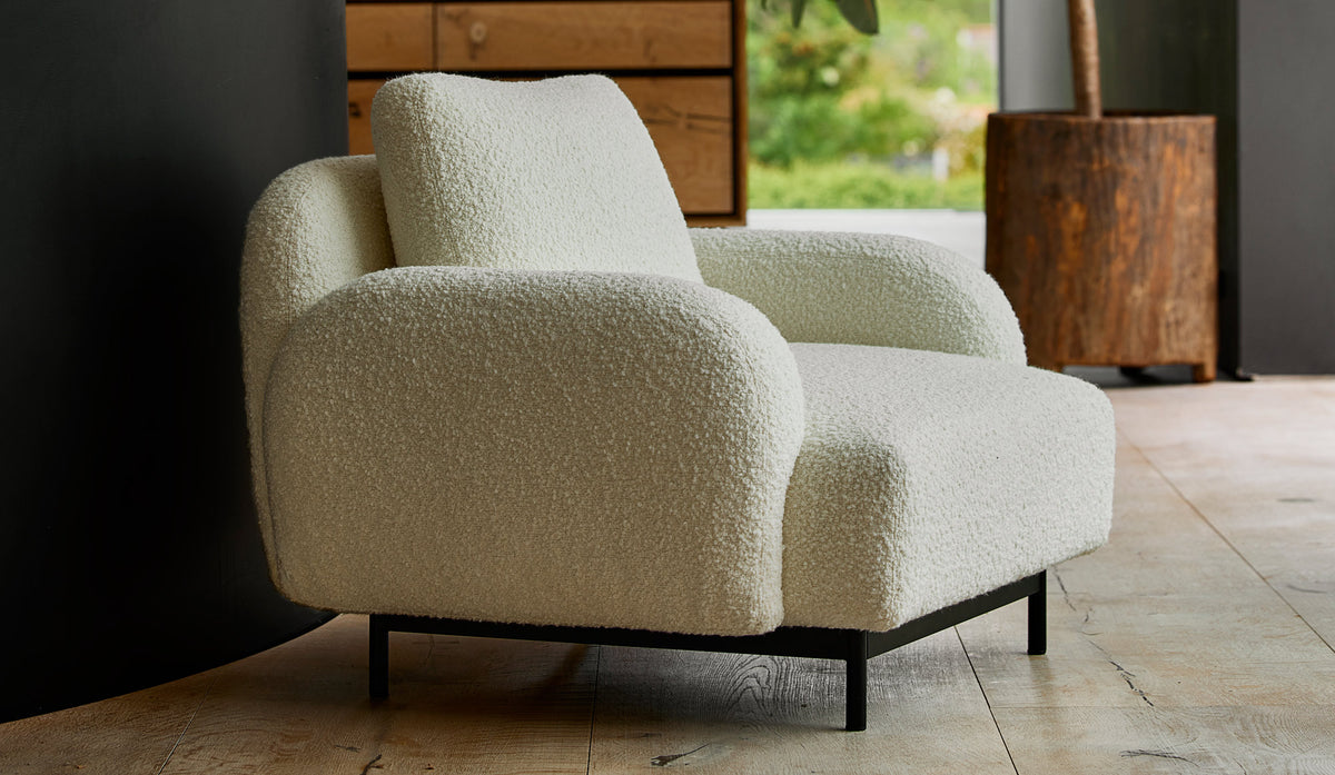 Aura Lounge Chair by Cane-Line, showing aura lounge chair in live shot.