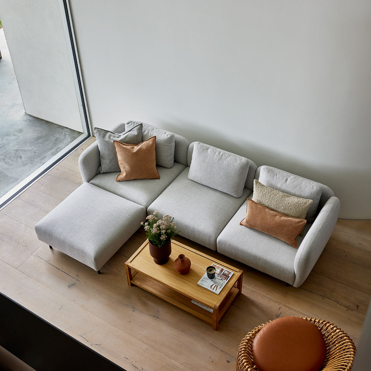 Aura pouf by Cane-Line, showing aura pouf in live shot.