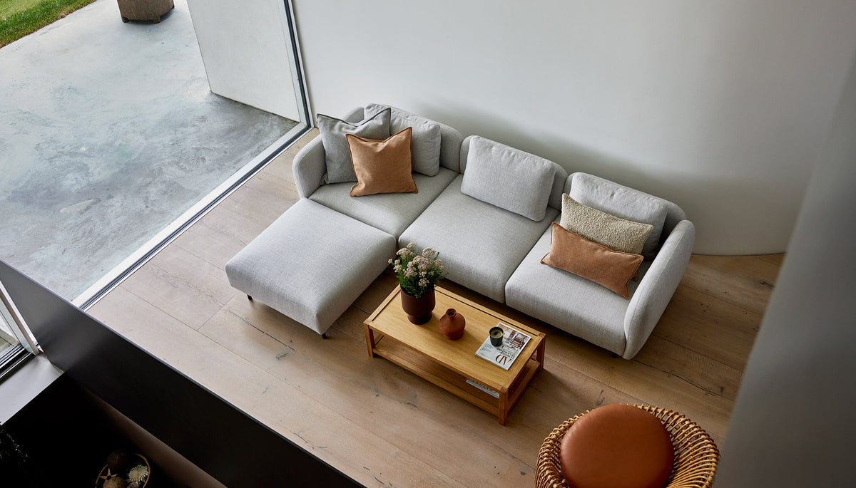 Aura Sectional by Cane-Line, showing aura sectional in live shot.