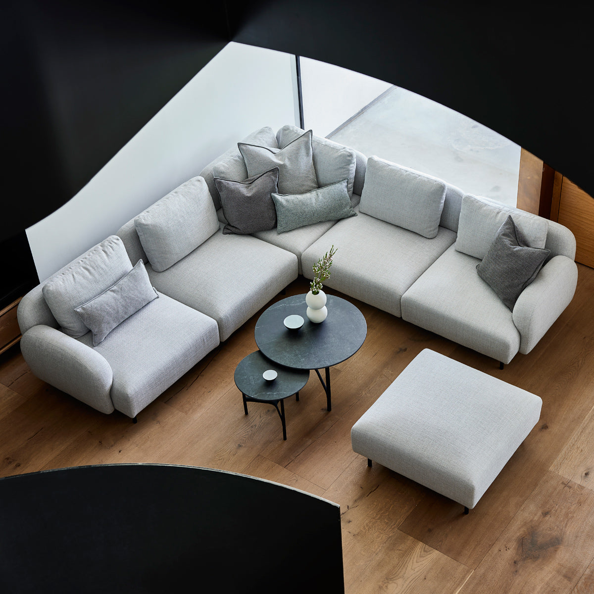 Aura Sectional by Cane-Line, showing aura sectional in live shot.
