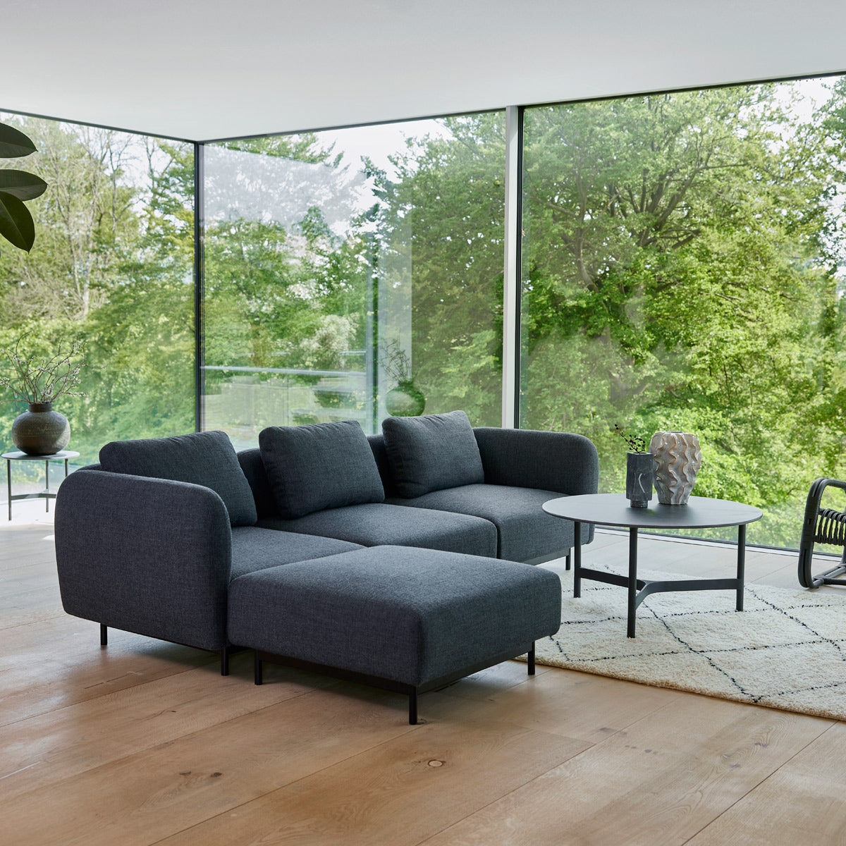 Aura Sectional by Cane-Line, showing aura sectional in live shot.
