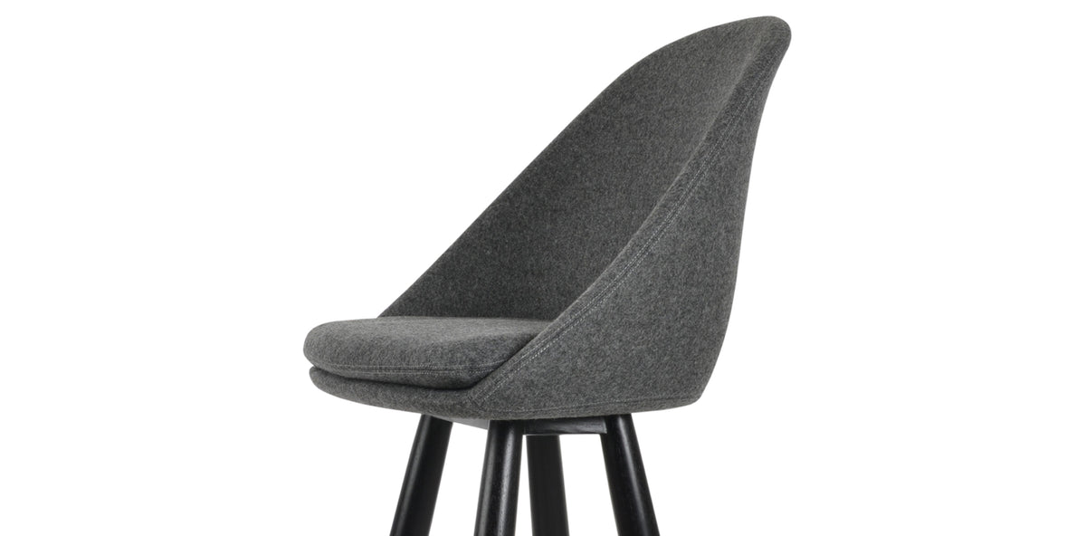 Avanos Baba Wood Stool by SohoConcept, showing closeup view of avanos baba wood stool in teak wenge wood/camira blazer dark grey wool.